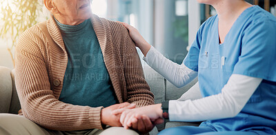 Buy stock photo Sofa, caregiver and old man with holding hands for support, empathy and console after diagnosis news. Home, nurse and senior patient with consultation for wellness, compassion or trust in living room