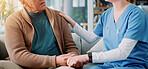 Home, caregiver and old man with holding hands for support, empathy and console after diagnosis news. Sofa, nurse and senior patient with consultation for wellness, compassion or trust in living room