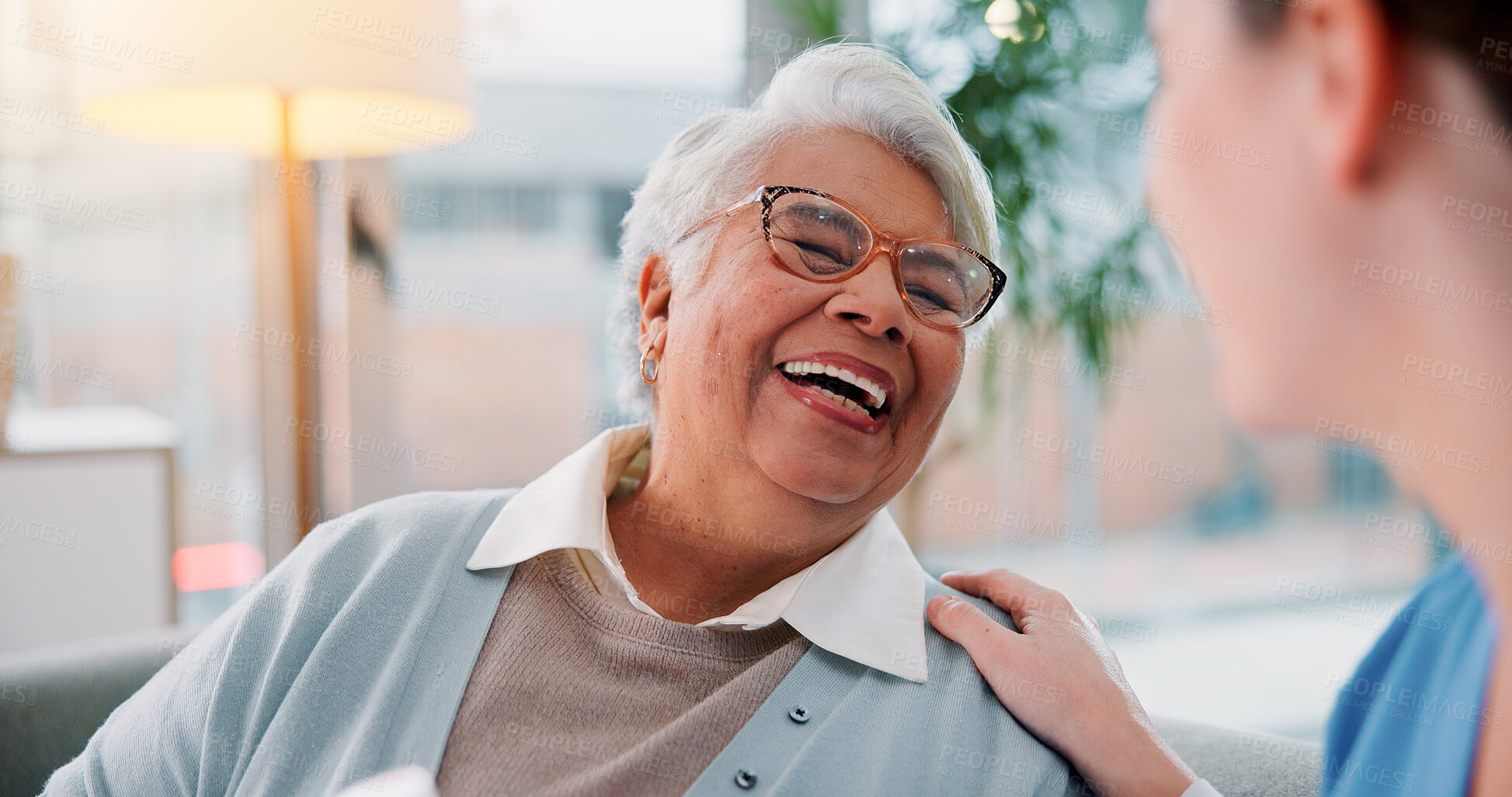 Buy stock photo Elderly woman, nurse and laughing in home for funny conversation, healthcare advice and empathy. Senior patient, caregiver and happy for homecare assistance, kindness and medical help in retirement