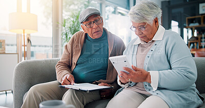 Buy stock photo Senior couple, calculator and documents on couch with finance, budget and review for bills in retirement. People, paperwork and partner with problem solving for wealth, saving or investing in home