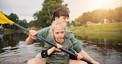Buy stock photo Lake, woman and child with learning for kayak, water activity and adventure in summer camp. River, female instructor and girl with support for canoeing, skills development and paddle outdoor in boat