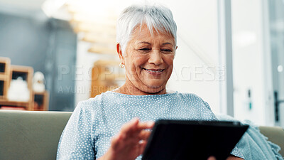 Buy stock photo Tablet, relax and senior woman on sofa in home learning for online communication, networking or social media. Happy, digital technology and elderly female person in living room reading news on app