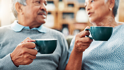 Buy stock photo Old couple, conversation and coffee in home with relaxing together, marriage and commitment with communication. Senior, man and woman with talking for love, care and retirement with drink in house
