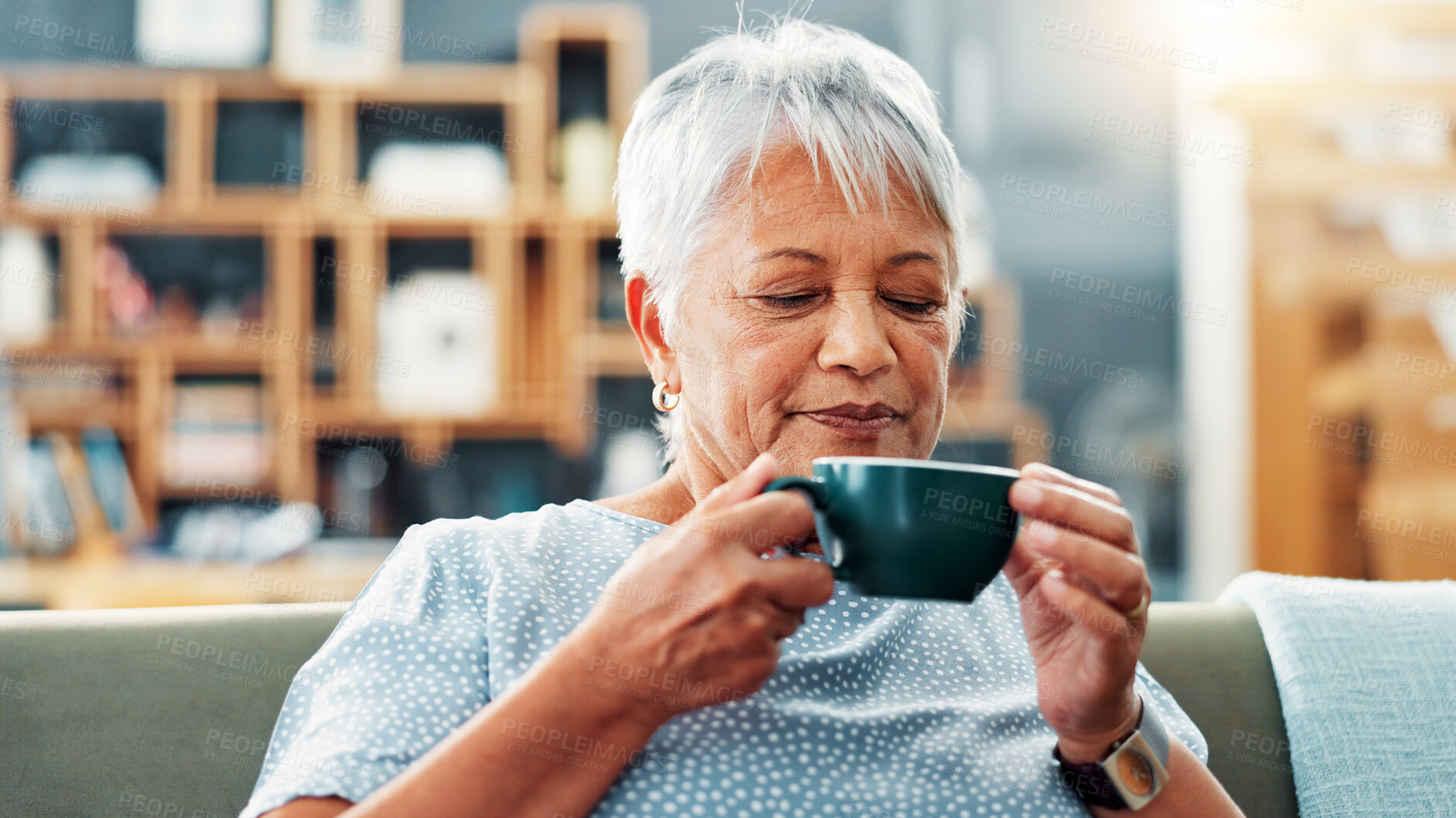 Buy stock photo Relax, drinking and senior woman with coffee on sofa for calm, peace and morning routine. Happy, cappuccino and elderly female person enjoying cup of tea on couch in living room at retirement home.