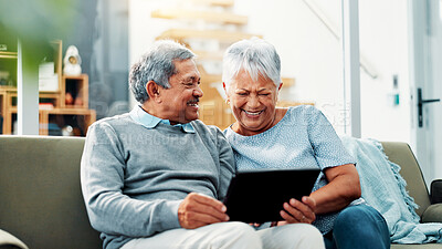 Buy stock photo Home, laughing and senior couple with tablet, watching and streaming of movies, online and living room. Retirement, old man and woman with tech for entertainment, bonding and smile for comedy film