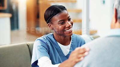 Buy stock photo Happy woman, nurse and hand on shoulder for healthcare, medical support or good news for wellness in home. Retirement, caregiver and comfort senior patient in living room for help, kindness and trust