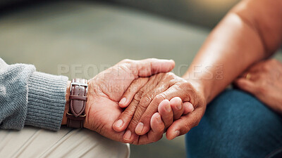 Buy stock photo Comfort, holding hands and support with couple in living room of home together for bonding, compassion or love. Empathy, sympathy and trust with people closeup in apartment for connection or healing