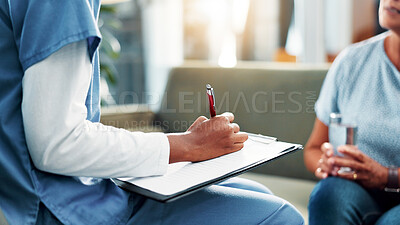 Buy stock photo Nurse, hands and writing with patient for counseling, therapy or consultation at old age home. Person, caregiver or health therapist taking notes with clipboard or client for symptoms or diagnosis