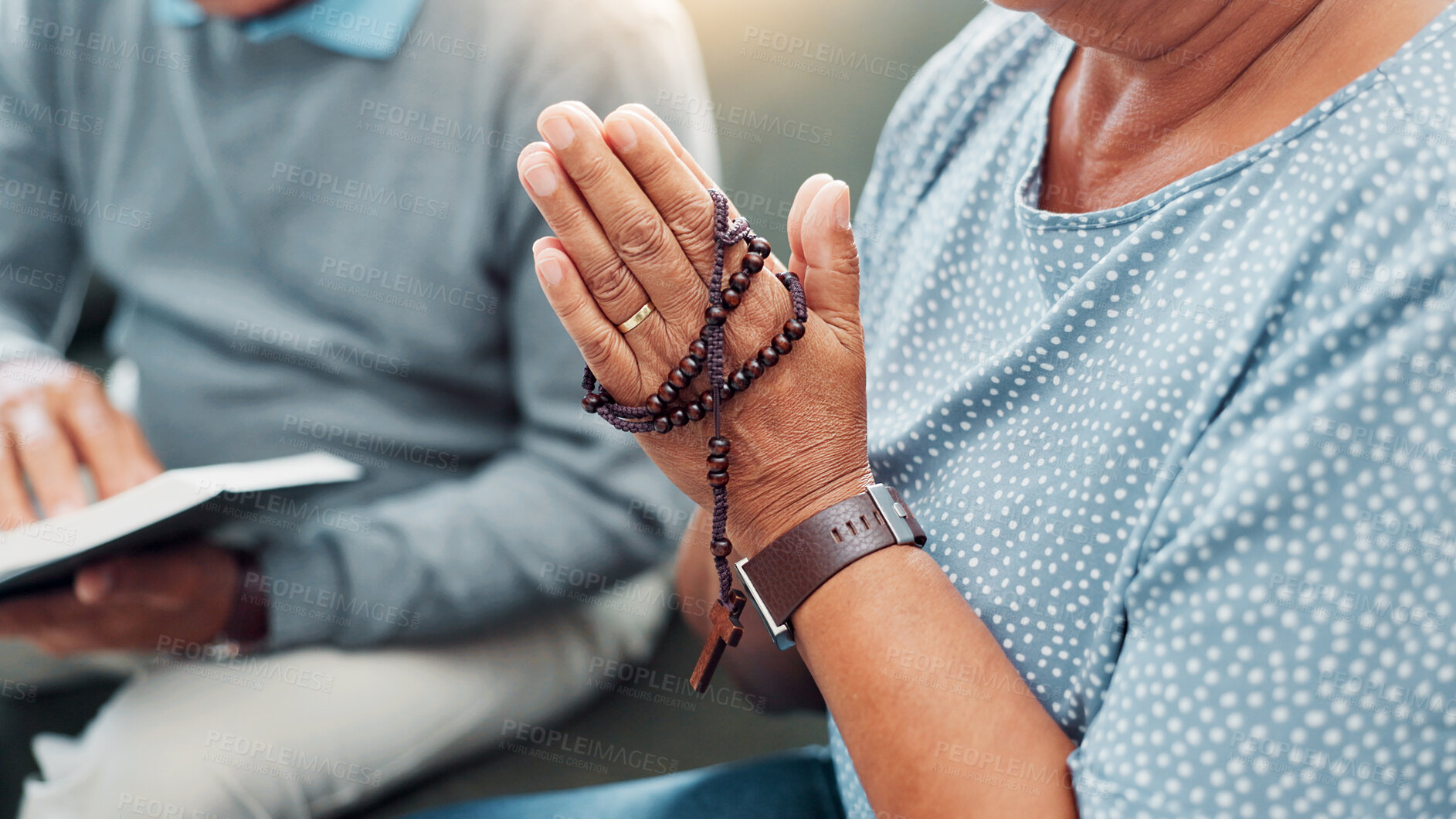 Buy stock photo Hands, rosary and couple religion with bible in home to worship Jesus Christ, spiritual faith and crucifix meditation. Old people, prayer and holy necklace on sofa with scripture guidance and praise