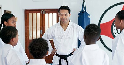 Buy stock photo Man, kids and karate with pep talk for self defense training, martial arts or help with youth and combat education. Motivation, encourage or male instructor with students or children coaching in dojo