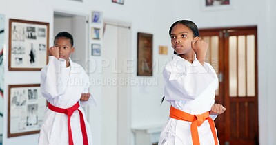 Buy stock photo Girl, children or karate student in dojo for combat, fighting tournament or sports training with dedication. Exercise, fitness workout or kids in gym for martial arts education, development or growth