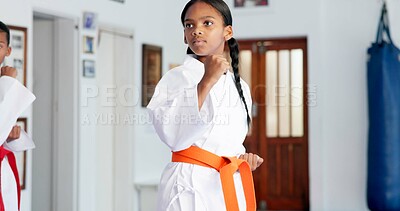 Buy stock photo Girl, learning and karate student in dojo for combat, kids tournament or sports training with dedication. Exercise, fitness workout and child in gym for martial arts education, development or growth