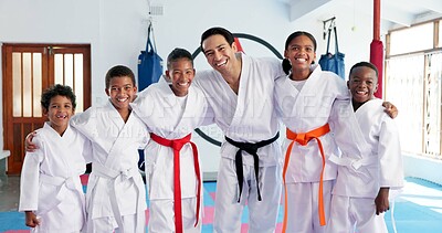 Buy stock photo Sensei, portrait and man with kids in karate class, self defense or martial arts with youth for combat education. Taekwondo pride, smile and male instructor with student children for coaching in dojo