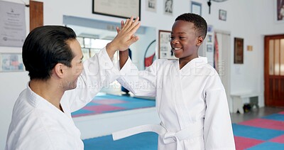 Buy stock photo Child, teacher and high five with karate, lesson and martial arts training for self defense or fighting competition. Boy, student and celebration with support for taekwondo challenge or community