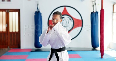 Buy stock photo Karate, portrait and ready with girl student in dojo for combat, martial arts or sports training. Exercise, fitness and workout with serious child in gym for education, development or growth