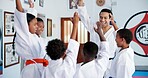 Children, teacher and hands together in dojo for martial arts training, self defense or fighting competition. Kids, motivation and celebration with support for taekwondo challenge or community karate