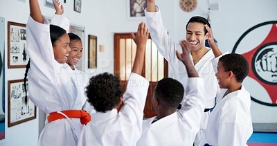 Buy stock photo Children, teacher and hands together in dojo for martial arts training, self defense or fighting competition. Kids, motivation and celebration with support for taekwondo challenge or community karate