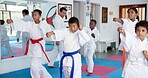 Fitness, karate and sports with kids in class for combat, fighting or self defense training. Development, exercise or growth with children and sensei in dojo for martial arts lesson or practice