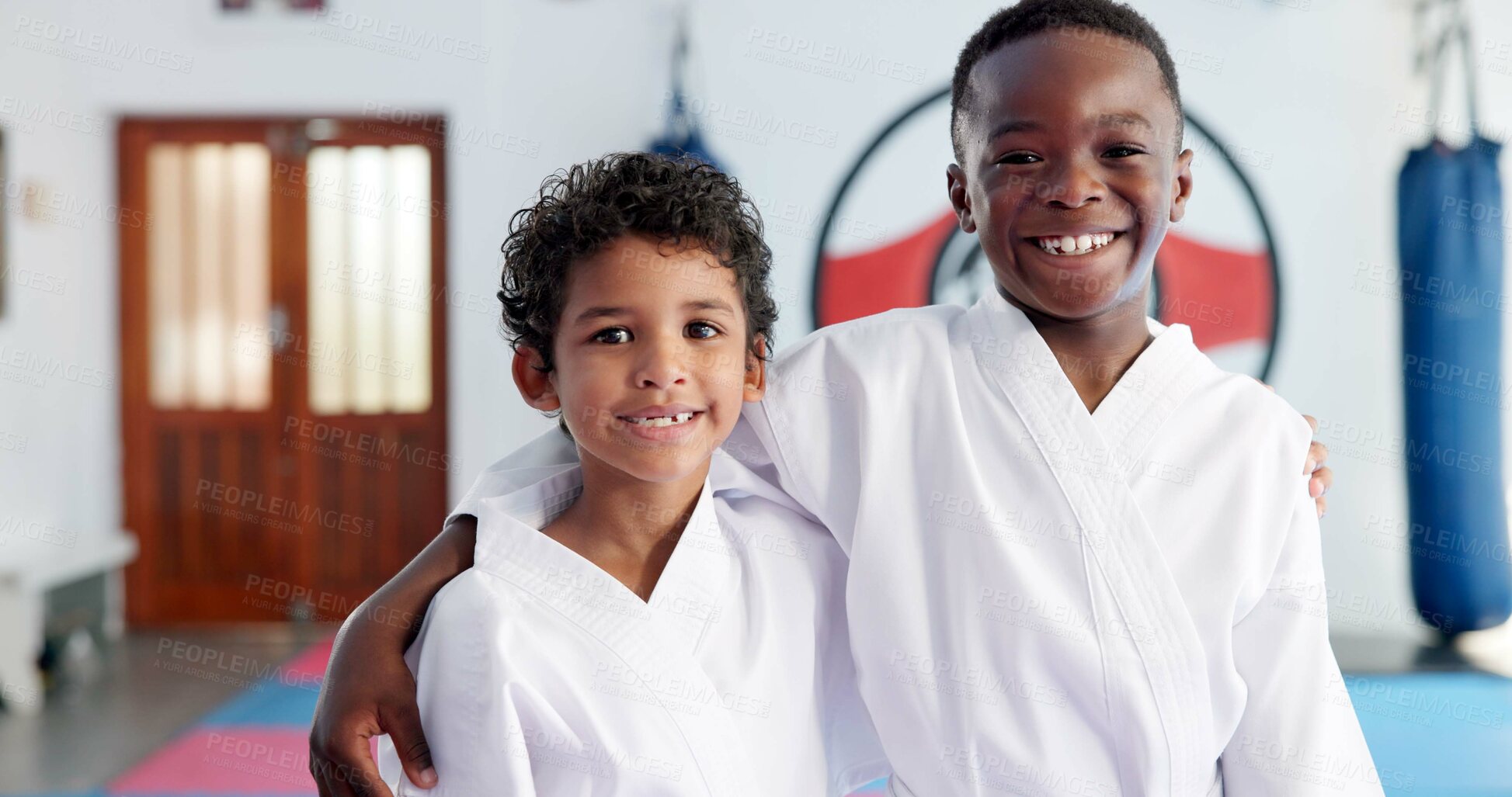 Buy stock photo Hug, karate and portrait of friends in class for martial arts, self defense or sports training. Development, fitness and smile of student kids embracing in dojo together for exercise or workout