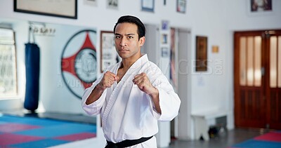 Buy stock photo Portrait, man and karate in dojo for self defense training, challenge or skill with martial arts. Serious, male person in fight pose and gym for taekwondo, fitness and combat sports for exercise
