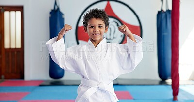 Buy stock photo Bicep, karate and portrait of boy student in dojo for combat, martial arts or sports training. Exercise, fitness and flexing muscles with happy child in gym for education, development or growth