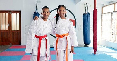 Buy stock photo Hug, karate and portrait of students in dojo for martial arts, self defense or sports training. Development, fitness and smile of child friends embracing in class together for exercise or workout