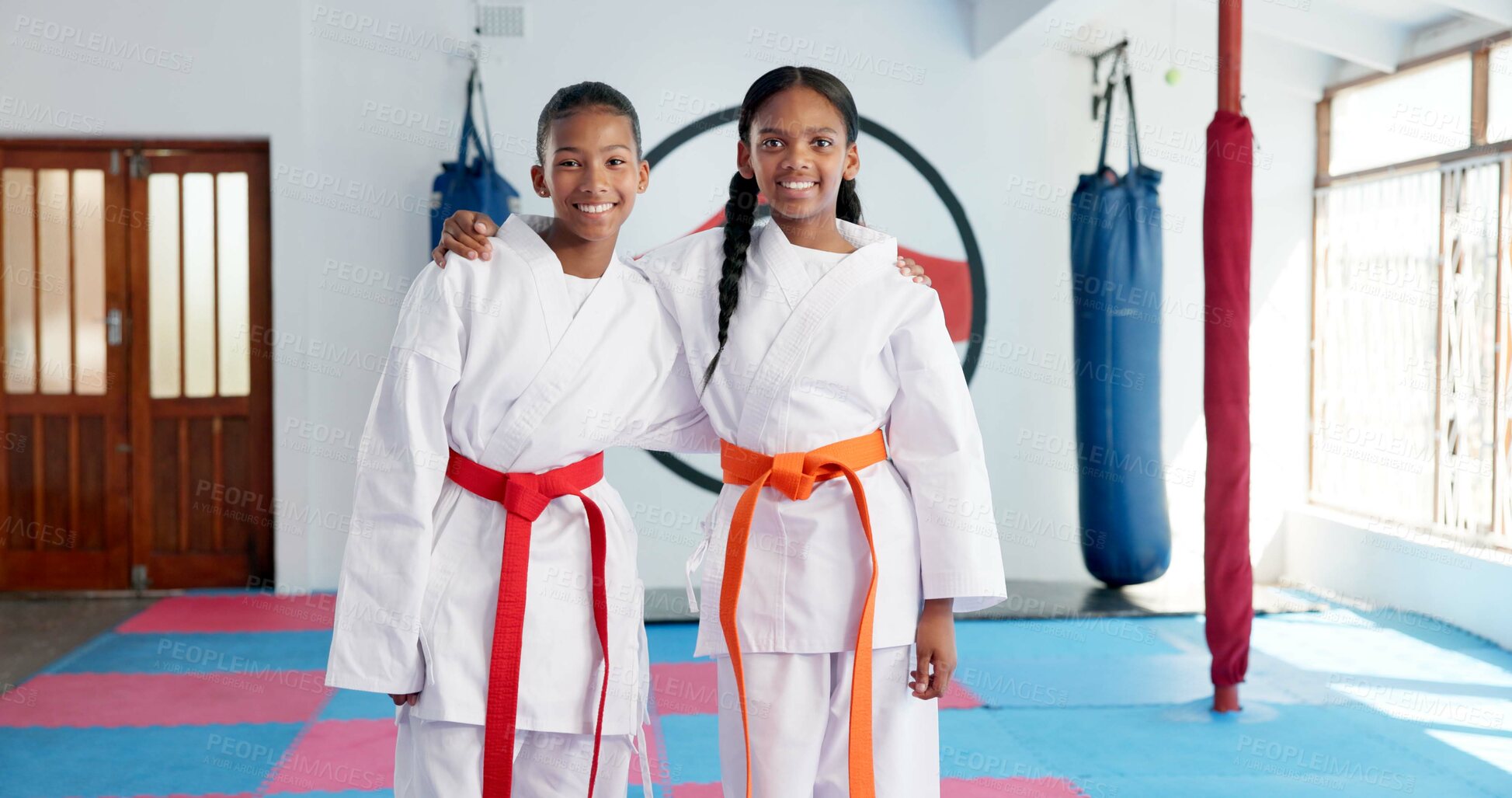 Buy stock photo Hug, karate and portrait of students in dojo for martial arts, self defense or sports training. Development, fitness and smile of child friends embracing in class together for exercise or workout