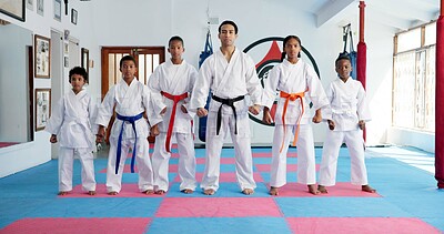 Buy stock photo Sensei, portrait and man with children in karate class, self defense or martial arts with youth for combat education. Taekwondo, group and male instructor with student kids for coaching in dojo