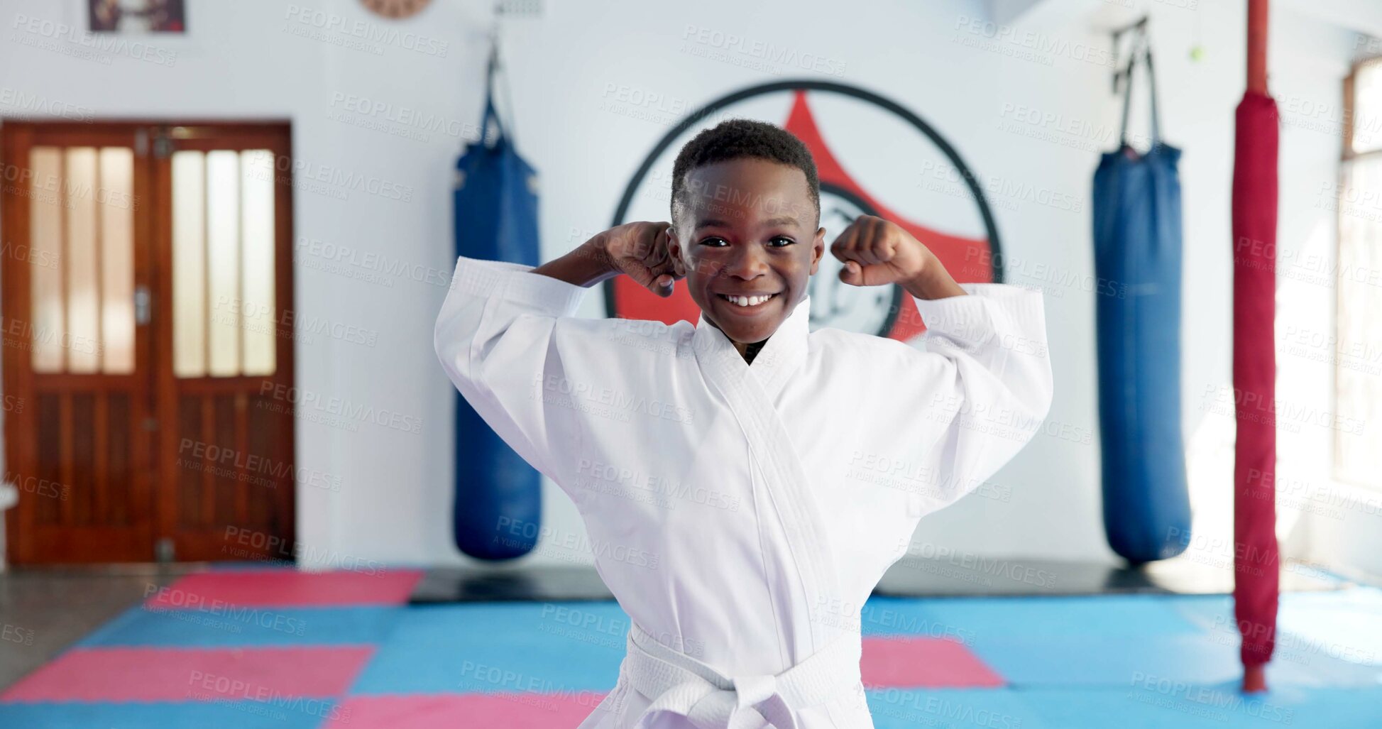 Buy stock photo Flex, karate and portrait of boy student in dojo for combat, martial arts or sports training. Exercise, fitness and confidence with happy African child in gym for education, development or growth