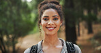 Hiking, smile and portrait of woman in nature with backpack for exercise, workout and walking. Fitness, travel and happy person in forest, trail and woods for trekking, adventure and travel outdoor