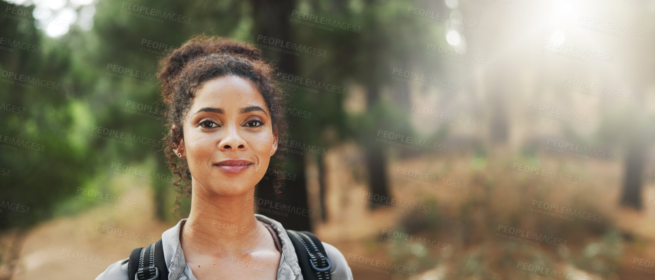 Buy stock photo Hiking, happy and portrait of woman in nature with backpack for exercise, trekking and travel. Fitness, space and person in forest for explore, adventure and journey outdoor for wellness and banner