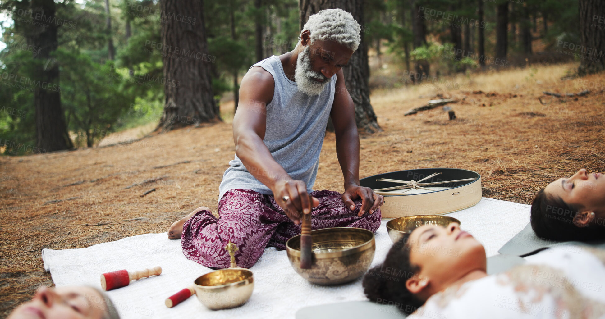 Buy stock photo Man, shaman and zen with holistic class or bowl in forest for sound, vibrations or outdoor healing. Male person, instructor or reiki guru with ornament for deep meditation, chakra balance or ritual