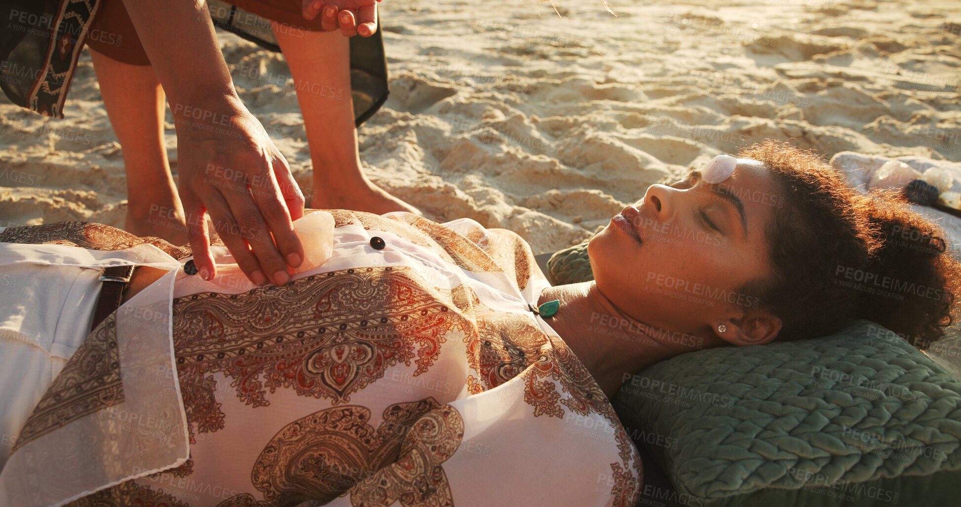 Buy stock photo Woman, crystal and healing at beach with chakra balance, care and therapy with rest on vacation. Person, stone and helping hand with mineral, mindfulness and peace with zen on ground in summer