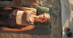 Woman, crystal and holistic at beach with chakra balance, care and therapy with above on vacation. Person, stone and breathing with mineral, mindfulness and peace with zen on ground in summer