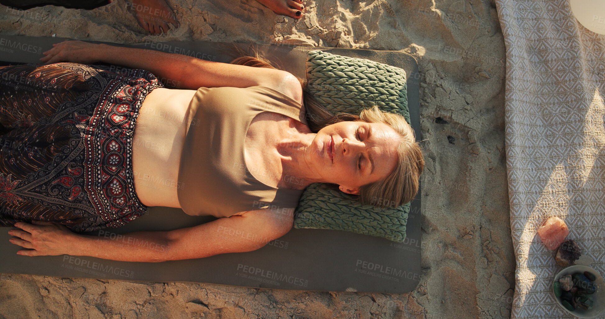 Buy stock photo Woman, crystal and therapy at beach with healing for chakra balance, holistic care and above on vacation. Person, stone and breathe with mineral, mindfulness and peace with zen on ground in summer