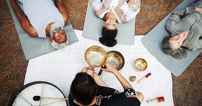 Buy stock photo Nature, sound therapy and above of people with bowls for mindfulness, spiritual cleanse and energy. Meditation, healer and men and women with vibration for healing, balance and wellness on floor