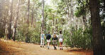 Fitness, back and people in nature for hiking, explore environment or journey on trail. Trekking group, guide and walking in forest for exercise, adventure route or outdoor for wellness activity