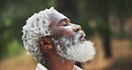 Outdoor, nature and black man with breathing for hiking, holiday and adventure for relaxing on weekend. senior person, hiker and face with peace for traveling, explore woods and fresh air for tourist