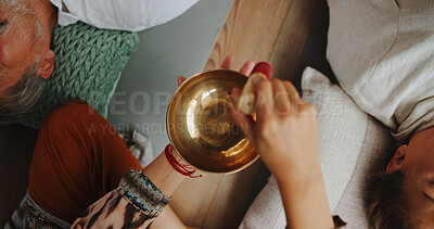 Buy stock photo Tibetan bowl, healing and hands of person in studio for wellness retreat, relax and meditation. Chakra balance, peace and sound therapy with above of shaman for energy, holistic ritual and closeup