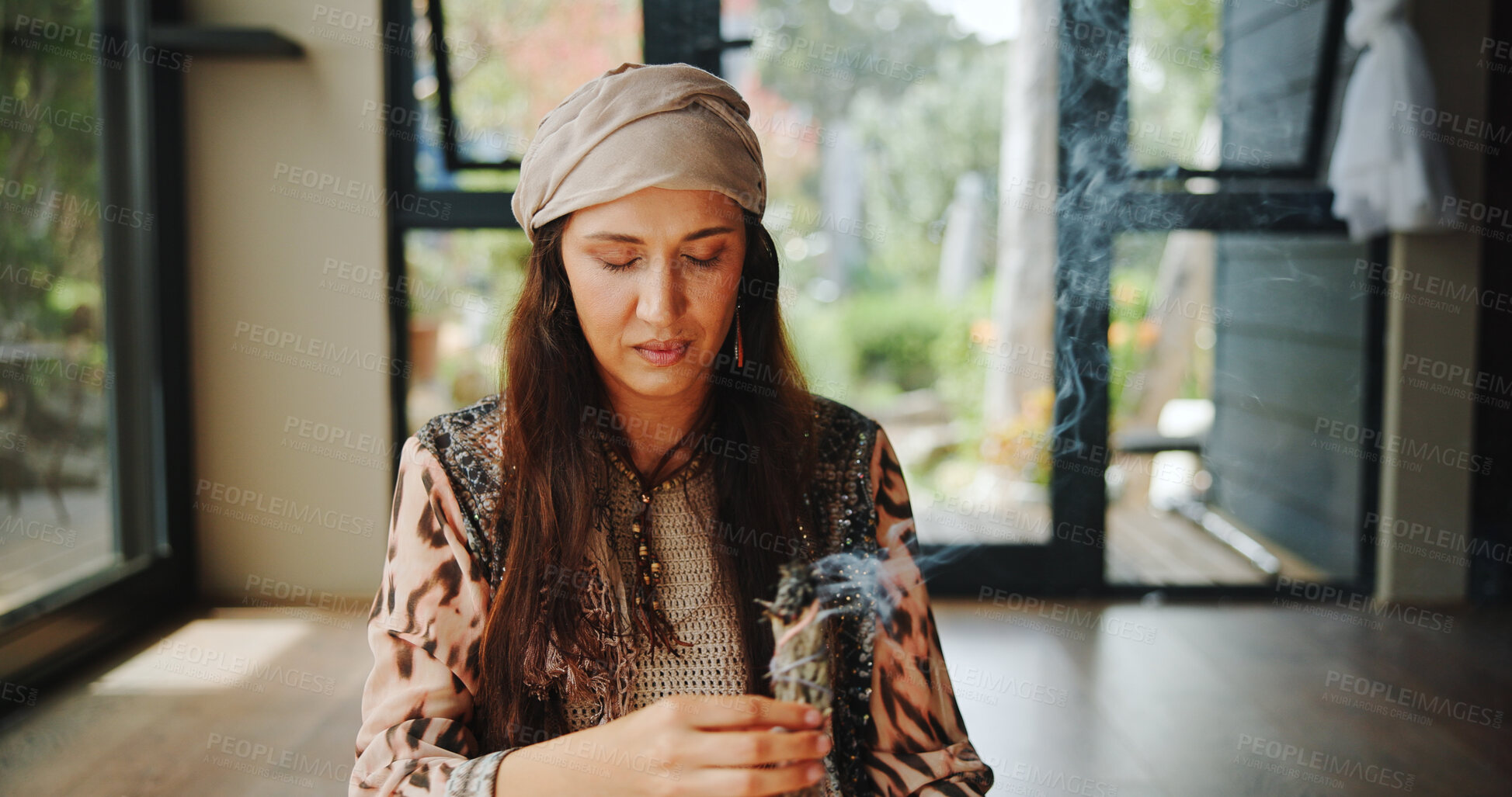 Buy stock photo Sacred, woman and sage with smoke, prayer and burning herb for purification and indigenous tradition. Chakra, spiritual and person with Salvia apiana for ritual, morning and smudging for inner peace