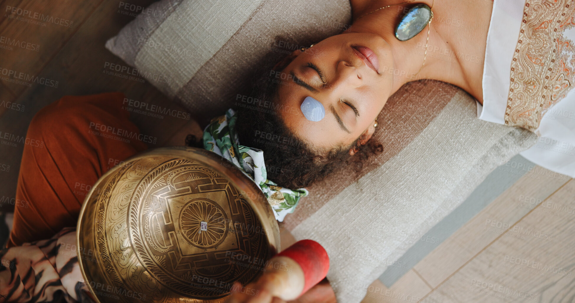 Buy stock photo Healing, calm and woman with healer, hands or mantra for inner peace, spiritual or gemstone for chakra. Meditation, shaman or sound therapy with Tibetan singing bowl, vibration or holistic for person