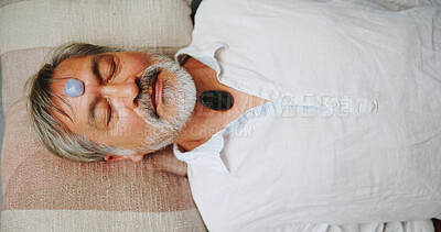 Buy stock photo Crystal, meditation and peace with Asian man on floor for energy balance, healing ritual or spirituality. Chakra, zen or holistic with above of senior person for aura cleanse and wellness ceremony