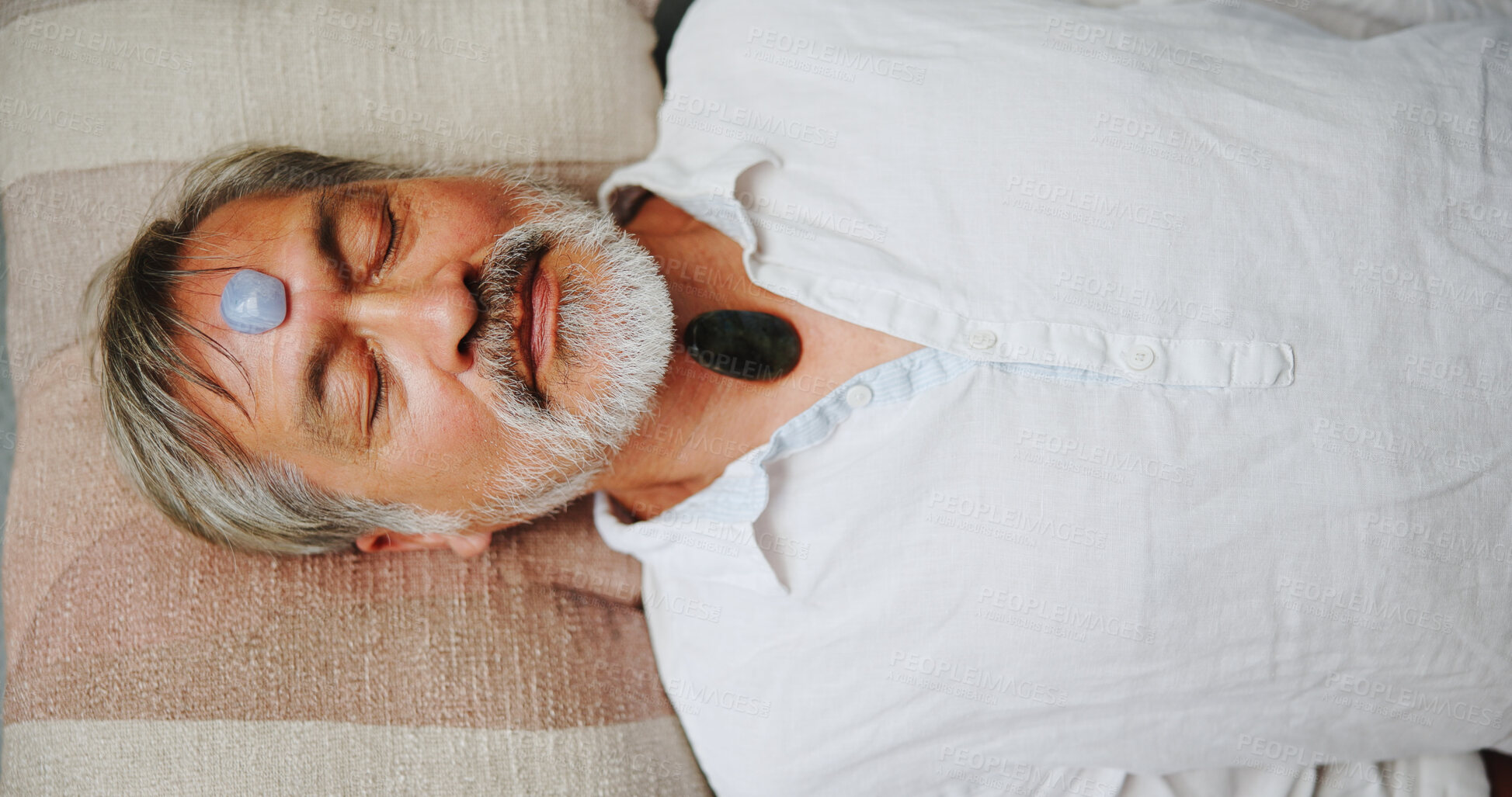 Buy stock photo Crystal, meditation and peace with Asian man on floor for energy balance, healing ritual or spirituality. Chakra, zen or holistic with above of senior person for aura cleanse and wellness ceremony