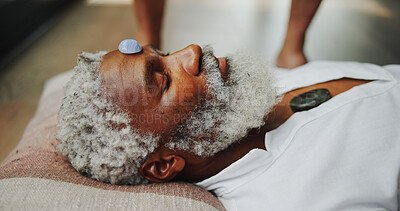 Buy stock photo Crystal, zen and healing with man on floor for energy balance, meditation ritual or spirituality. Third eye chakra, peace or holistic with senior person for aura cleanse, shaman and wellness ceremony