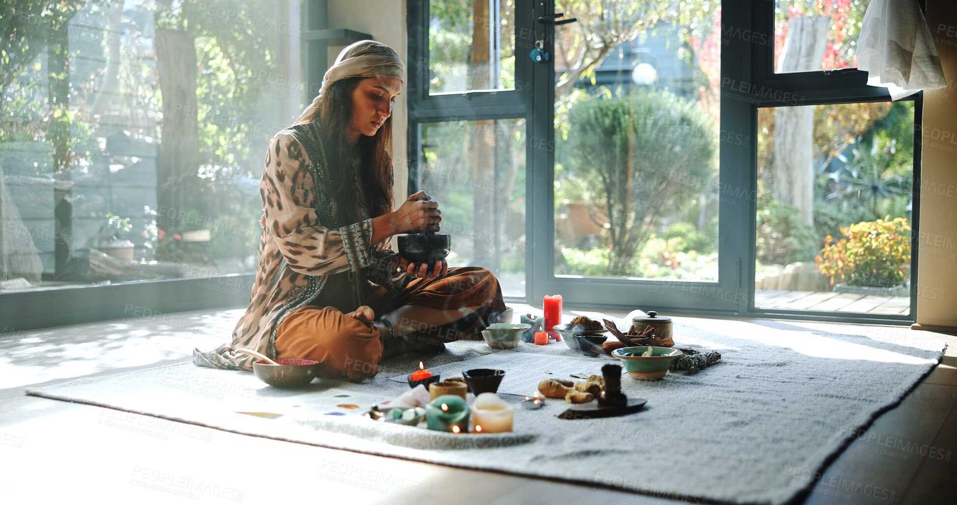 Buy stock photo Woman, natural healing and meditation with naturopath for Buddhism, ceremony and culture in studio. Healer, grinding herbs and aromatherapy for spirituality with incense or alternative medicine
