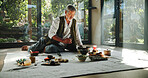 Floor, alternative medicine and Asian man for holistic treatment, spiritual meditation and healing. Aromatherapy, incense and healer with crystal stones for peace, chakra and detox for wellness