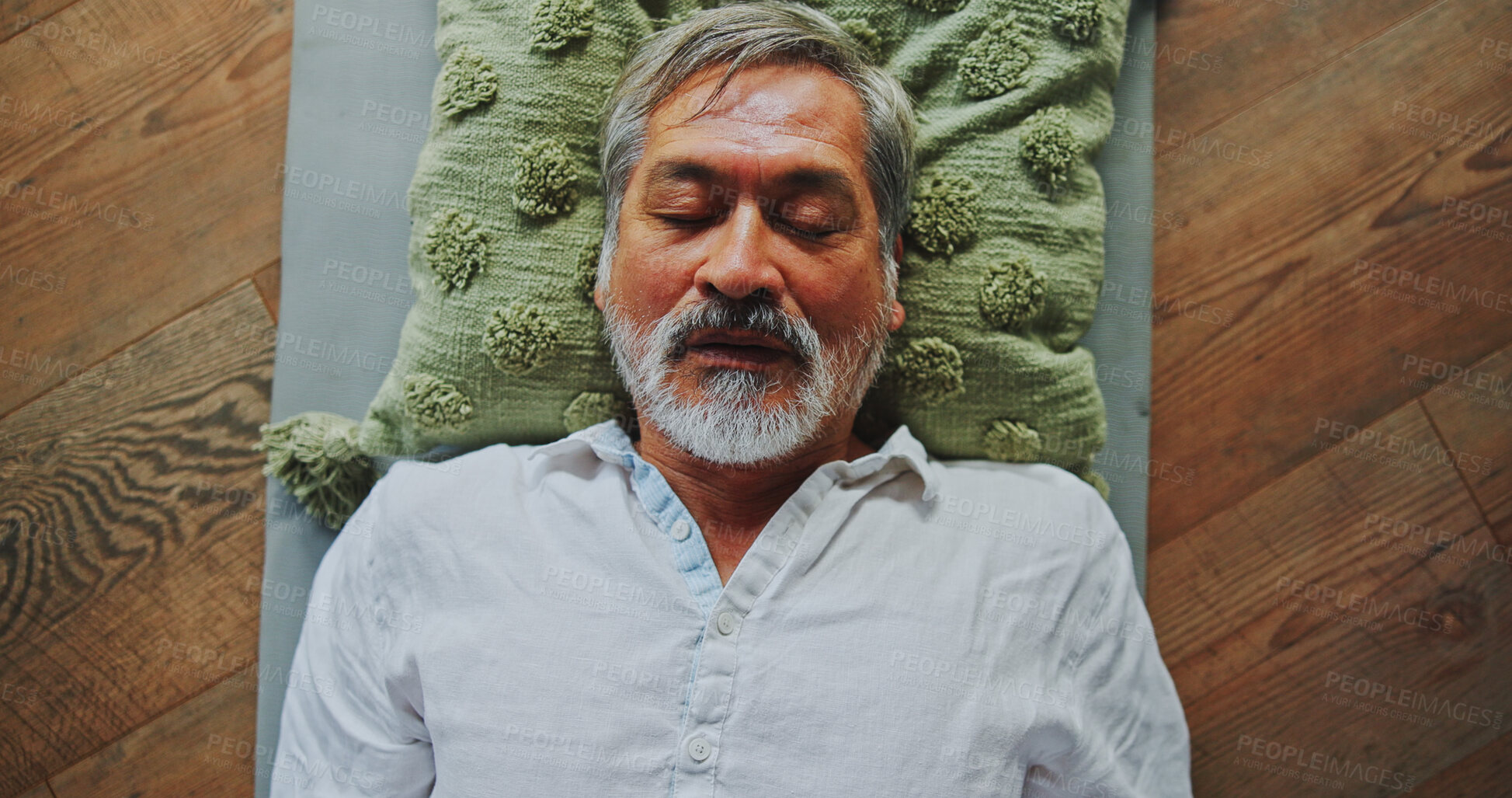 Buy stock photo Relax, calm and man at meditation class for mindfulness, peace and balance practice. Zen, yoga nidra and mature person at somatic healing session for wellness or trauma release on floor from above.