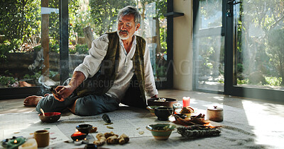 Buy stock photo Crystal, alternative medicine and Asian man for spiritual meditation, holistic treatment and healing on floor. Aromatherapy, incense and healer with stones for peace, chakra and detox for wellness