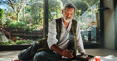 Buy stock photo Healing, smoke and holistic with asian man and incense for spiritual retreat, self care ritual and burning herbs. Aromatherapy, mindfulness and wellness ceremony with senior person for aura cleanse