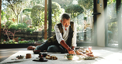 Buy stock photo Crystal, alternative medicine and mature man on floor for spiritual meditation, holistic treatment and healing. Aromatherapy, incense and healer with stones for peace, chakra and detox for wellness